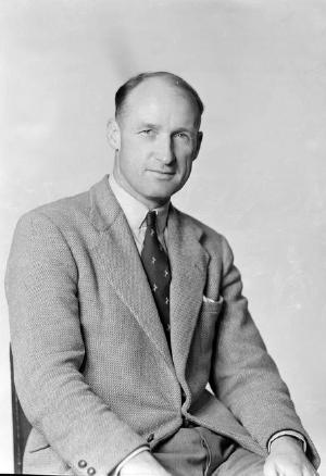 Terence (T P) McLean, press correspondent for the 1953-1954 All Black touring team. Crown Studios Ltd :Negatives and prints. Ref: 1/2-207206-F. Alexander Turnbull Library, Wellington, New Zealand. http://natlib.govt.nz/records/23151814